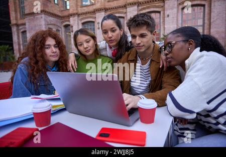 Group of students, high school pupils gather in college cafeteria, discuss topics, work together Stock Photo