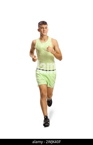Teenage guy in sportswear jogging towards camera isolated on white background Stock Photo