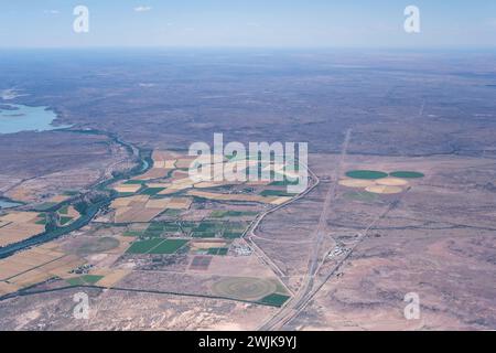 aerial cityscape with  agricultural area near Fish river in desert,  shot from a glider plane in bright late spring light north of Mariental, Namibia, Stock Photo
