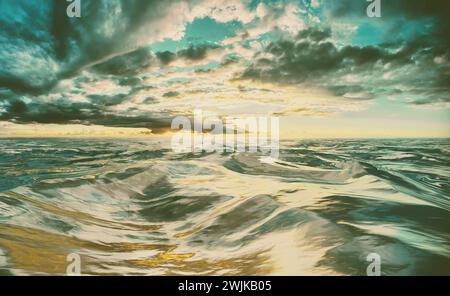 Dramatic storm over rough, choppy body of water during sunset or sunrise Stock Photo