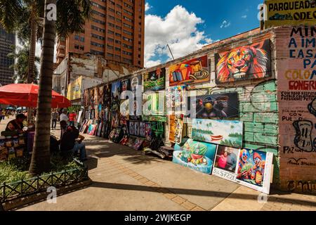 Medellin, Colombia - 9th December 2023: Street vendors in action, selling art on the vibrant streets of Medellin, contributing to the city's artistic Stock Photo