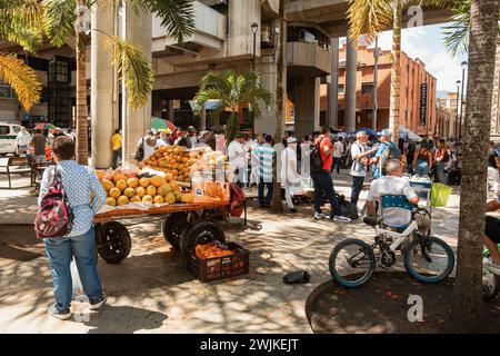 Medellin, Colombia - December 9, 2023: Street view capturing the essence of daily life in Medellin with ordinary people going about their routines. An Stock Photo