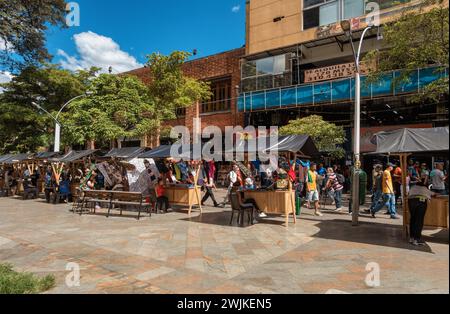 Medellin, Colombia - December 9, 2023: Street view capturing the essence of daily life in Plaza Botero with ordinary people going about their routines Stock Photo