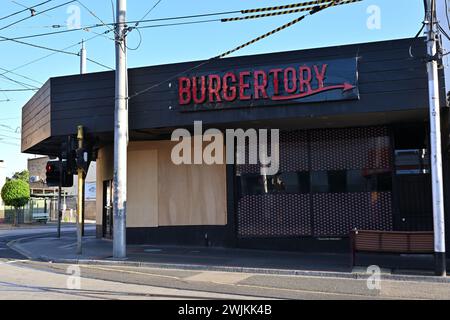 Boarded up Burgertory fast food restaurant, weeks after the shop was damaged by fire Stock Photo