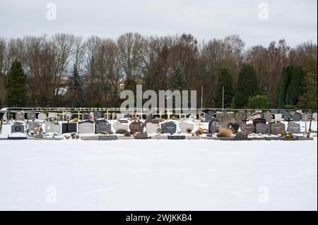 Berchem Sainte Agathe, Brussels, Belgium, 21 January 2024 - Graveyard of the municipality covered in snow Stock Photo