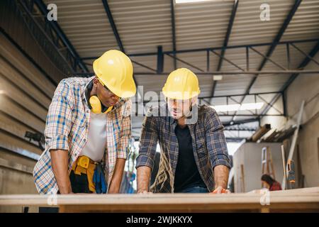 Two carpenter man wear meeting planning job together Stock Photo