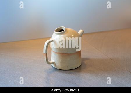 Handmade ceramic tea pot over kitchen counter. High quality photo Stock Photo