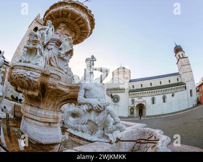 The Neptune fountain in Dome place in front of the Medieval Cathedral of San Vigilio in Trento , Italy Stock Photo