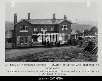 AN ENGLISH ROADSIDE STATION. STATION BUILDINGS AND ENTRANCE TO GOODS YARD. from the Article ENGLISH GOODS STATIONS AND RAILWAY YARDS. By Arch. R. Whitehead. from The Engineering Magazine Devoted to Industrial Progress Volume XIV October 1897 - March 1898 The Engineering Magazine Co Stock Photo