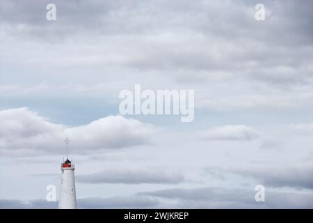 Reykjansviti lighthouse by cloudy sky Stock Photo