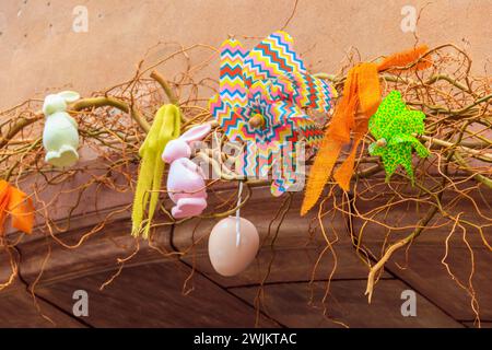 Easter decoration with Easter bunnies and Easter eggs on a house Stock Photo