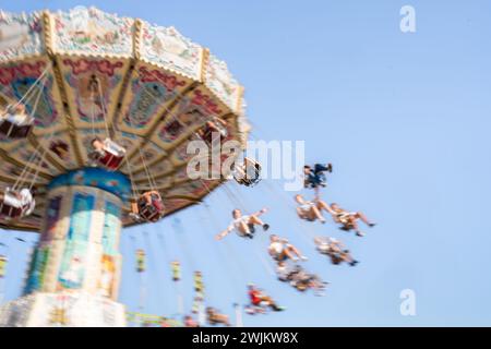 People Up In The Air On Swings at Tulsa State Fair Stock Photo