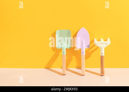 Set of gardening tools on yellow background. spring gardening vibes. Stock Photo