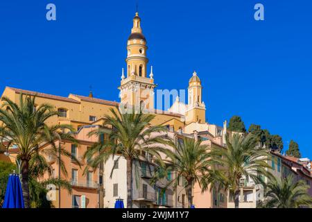 Beautiful Menton on the French Riviera - Côte d'Azur, France. Picture perfect, multicoloured, houses are built over the hillside from the Old Port. Stock Photo