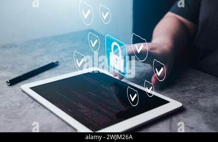 Woman use digital tablet with hologram cybersecurity interface. Protected information. Encrypted and secured internet access. Stock Photo