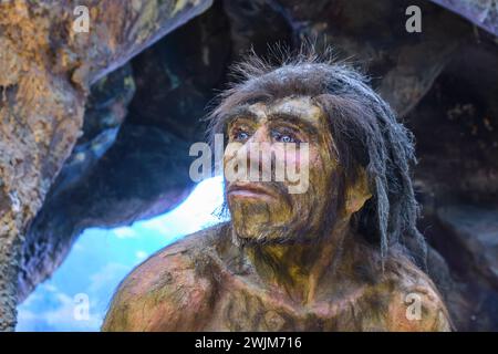 A close up of a male hunter. Detail of a paleolithic, stone age, cave man diorama at the Biological Museum on the campus of Al-Farabi Kazakh National Stock Photo