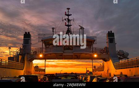 Wolfe Islander III ferry crossing Lake Ontario at sunset Stock Photo