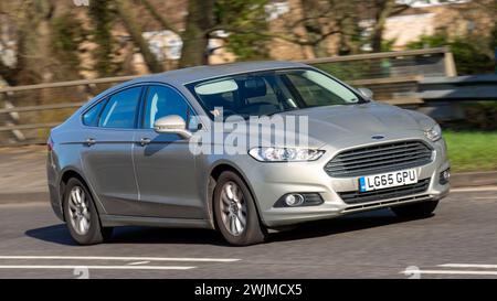 Milton Keynes,UK-Feb 13th 2024: 2015 silver diesel engine Ford Mondeo car  driving on an English road Stock Photo