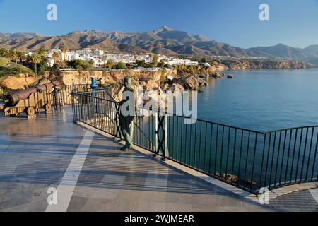NERJA, ANDALUSIA, SPAIN - DECEMBER 25, 2023: The bronze statue of the King Alfonso XII in Balcon de Europa Stock Photo