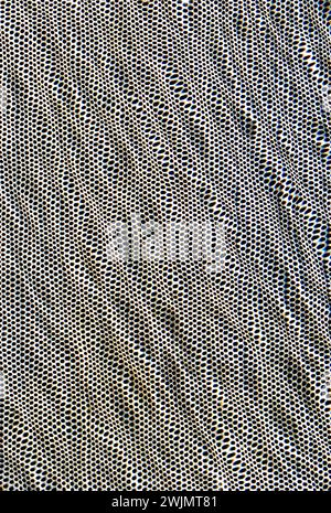 Perforated metal surface underwater texture background Stock Photo