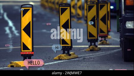 Image of multiple hi and hello text on vintage speech bubbles over road traffic Stock Photo