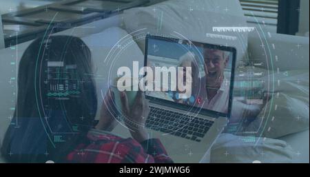 Image of scope scanning and data processing over woman using laptop on image call Stock Photo