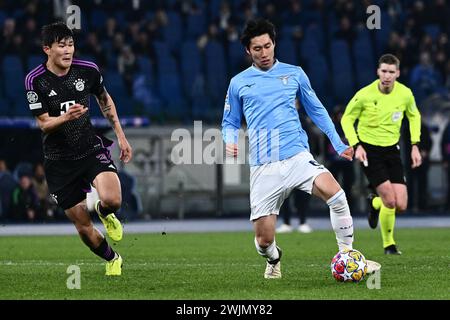 Daichi Kamada of SS Lazio and Kim Min-Jae of FC Bayern Munchen compete for the ball  during the Uefa Champions League match between SS Lazio and FC Ba Stock Photo