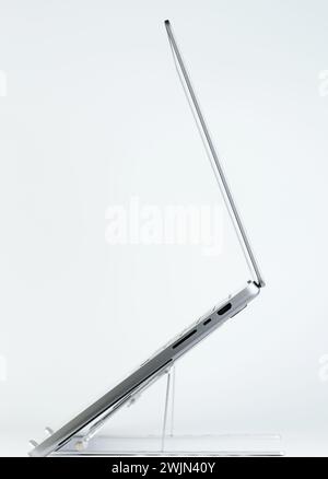 Laptop side profile on stand isolated on white studio background Stock Photo
