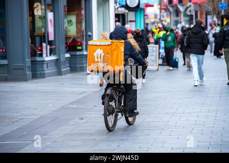 Leicester, Leicestershire, UK. 16th February 2024. Just Eat, Uber Eats and Deliveroo cyclists working in Leicester City Centre. Credit: Alex Hannam/Alamy Live News Stock Photo