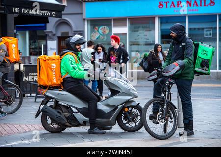 Leicester, Leicestershire, UK. 16th February 2024. Just Eat, Uber Eats and Deliveroo cyclists working in Leicester City Centre. Credit: Alex Hannam/Alamy Live News Stock Photo