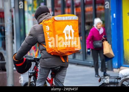 Leicester, Leicestershire, UK. 16th February 2024. Just Eat, Uber Eats and Deliveroo cyclists working in Leicester City Centre. Credit: Alex Hannam/Alamy Live News Stock Photo