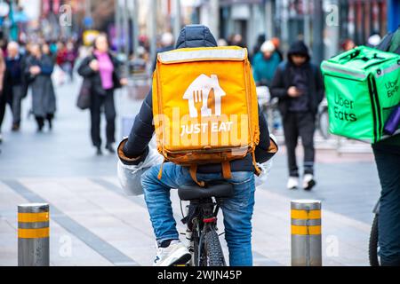 Leicester, Leicestershire, UK. 16th February 2024. Just Eat, Uber Eats and Deliveroo cyclists working in Leicester City Centre. Credit: Alex Hannam/Alamy Live News Stock Photo