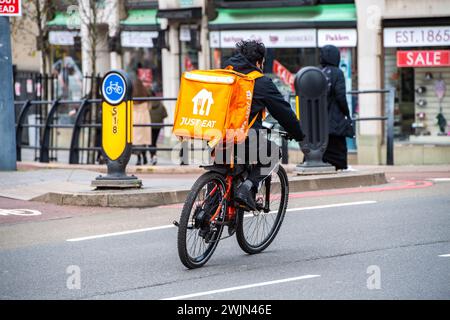 Leicester, Leicestershire, UK. 16th February 2024. Just Eat, Uber Eats and Deliveroo cyclists working in Leicester City Centre. Credit: Alex Hannam/Alamy Live News Stock Photo