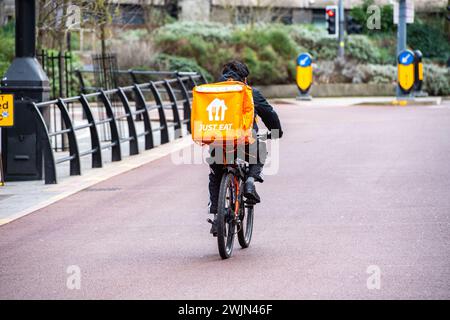 Leicester, Leicestershire, UK. 16th February 2024. Just Eat, Uber Eats and Deliveroo cyclists working in Leicester City Centre. Credit: Alex Hannam/Alamy Live News Stock Photo