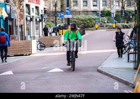 Leicester, Leicestershire, UK. 16th February 2024. Just Eat, Uber Eats and Deliveroo cyclists working in Leicester City Centre. Credit: Alex Hannam/Alamy Live News Stock Photo