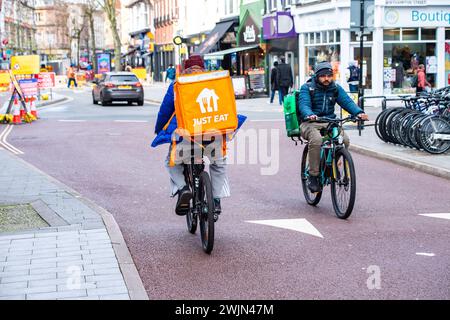 Leicester, Leicestershire, UK. 16th February 2024. Just Eat, Uber Eats and Deliveroo cyclists working in Leicester City Centre. Credit: Alex Hannam/Alamy Live News Stock Photo