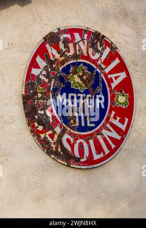 A vintage sign for Magnolia gasoline & motor oil on a building in San Antonio, a small town in rural New Mexico. Stock Photo