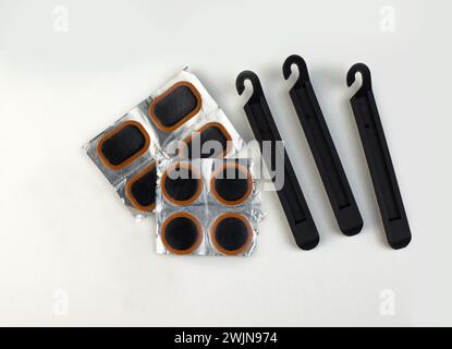 Bicycle puncture repair kit on a white Stock Photo