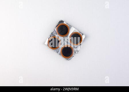 Bicycle puncture repair kit on a white Stock Photo