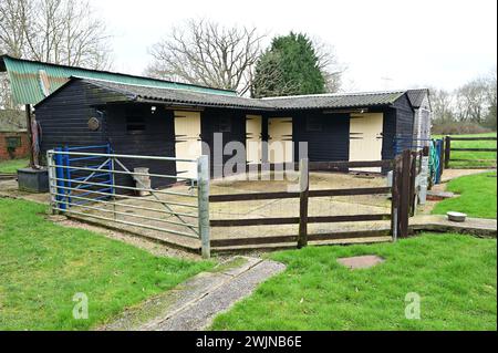 Stables and a Stables yard for horses in the UK Stock Photo