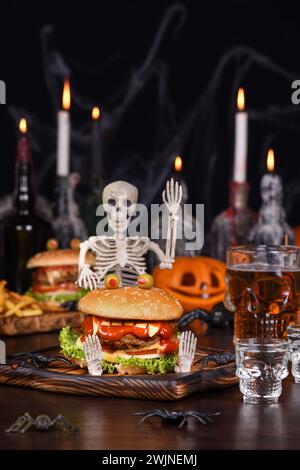 The Monster Burger on a sitting skeleton will definitely lift your spirits and is the perfect Halloween party appetizer. Stock Photo
