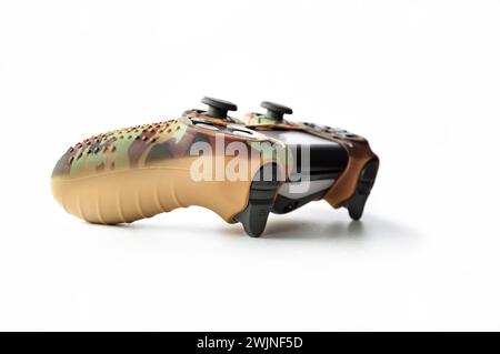 RZHEV, RUSSIA - May 23, 2021: New Sony Dualshock 4 for PlayStation 4 in a camouflage case on a white background. Game console Sony PlayStation 4 of th Stock Photo