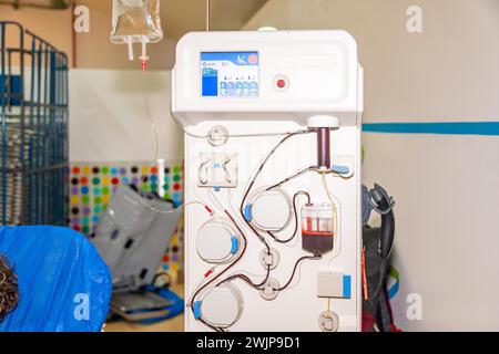 Machine that separates red blood cells from plasma in the blood with no people around in a donation center Stock Photo