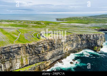 Aerial view of Dun Aonghasa or Dun Aengus , the largest prehistoric stone fort of the Aran Islands, popular tourist attraction, important archaeologic Stock Photo