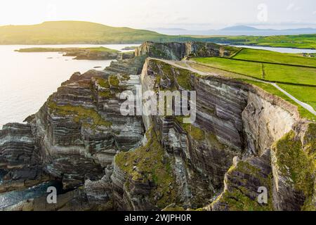 Amazing wave lashed Kerry Cliffs, widely accepted as the most spectacular cliffs in County Kerry, Ireland. Tourist attractions on famous Ring of Kerry Stock Photo