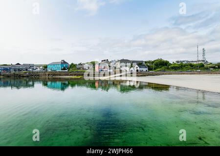 Blue waters in harbor of Kilronan of Inishmore, the largest of the Aran Islands in Galway Bay, Ireland. Famous for its strong Irish culture, loyalty t Stock Photo