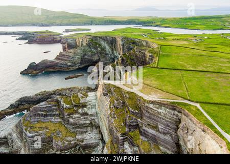 Amazing wave lashed Kerry Cliffs, widely accepted as the most spectacular cliffs in County Kerry, Ireland. Tourist attractions on famous Ring of Kerry Stock Photo