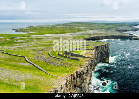 Aerial view of Dun Aonghasa or Dun Aengus , the largest prehistoric stone fort of the Aran Islands, popular tourist attraction, important archaeologic Stock Photo