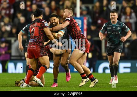 Esan Marsters of Huddersfield Giants is tackled by Jack Hughes of Leigh Leopards during the Betfred Super League Round 1 match Leigh Leopards vs Huddersfield Giants at Leigh Sports Village, Leigh, United Kingdom, 16th February 2024  (Photo by Craig Thomas/News Images) Stock Photo