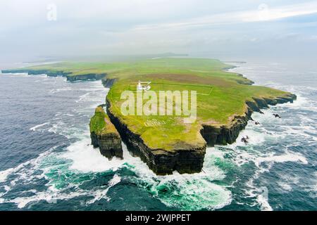 Aerial view of the Loop Head Lighthouse, located south-east of Kilkee, on the northern Dingle Peninsula, on the cliffs of Loop Head in County Clare, I Stock Photo